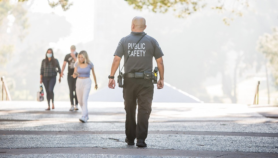 PSO walking into the sunlight at Langson Library quad